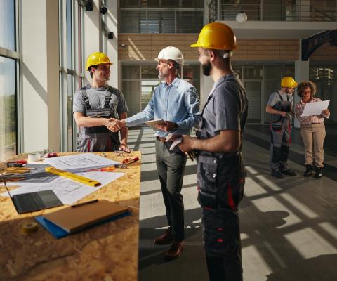 building workers discussing plans